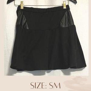 Black skirt. Beautiful and made out of cotton. Has leather patches